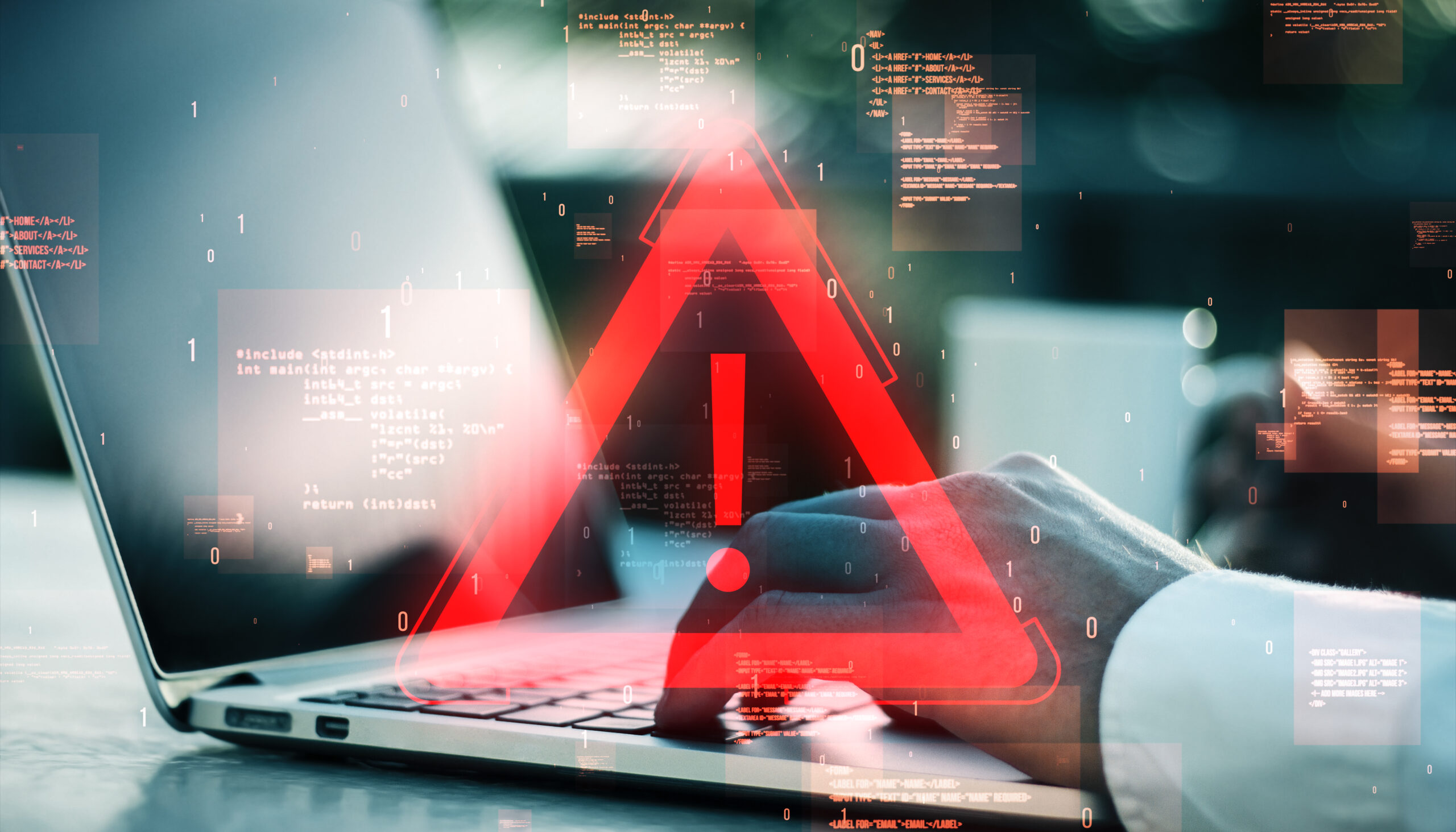 Red exclamation warning symbol over a laptop with code in the background representing a digital error or alert concept.
